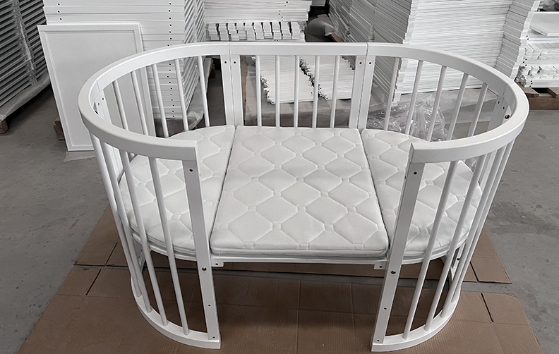 Oval baby bed